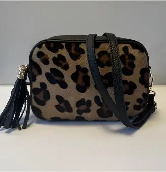 Kleine tas met een verstelbare riem